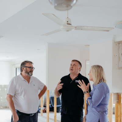 QBE claims officers discuss some restoration work at a home in Townsville with a QBE supplier.
